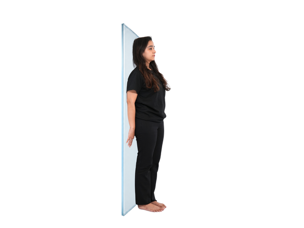 Standing wall-supported glute squeeze (2 min)